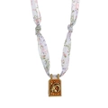 Capricorn zodiac pendant necklace with a vintage gold relief and floral silk ribbon strap - Capricorn