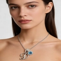 Elegant silver necklace featuring diamond letter D and a square blue gemstone pendant - Silver D