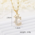 Detailed view of crown-topped letter C pendant with dimensions 2.8cm by 1.3cm - Gold C