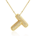 Dettaglio della collana dorata con pendente a pillola a forma di T con zirconi - Lettera T (Solo ciondolo)