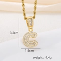 Detail view of 18k gold plated letter C pendant with baguette and round zircons - C Style - Gold (Pendant And Rope Chain)