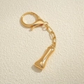 Portachiavi a forma di osso placcato oro 18K con chiusura a moschettone e finitura lucida - Lettera I