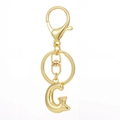 Detailed view of gold plated 3D letter G keychain pendant with lobster clasp and flat ring - Gold - Letter G