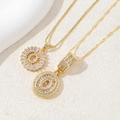 Detail of gold-plated necklaces with baguette-cut and round-cut cubic zirconia pendants - Letter O