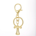 Close-up of polished 18K gold plated letter T alphabet keychain with lobster clasp - Gold - Letter T