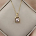 Detail of pink rectangular zircon pendant in gold plating on elegant pink silk cloth - Pink