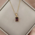 Close-up of a 18K gold stainless steel necklace with a red zircon rectangle pendant - Dark Red