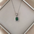 Close-up of luxury 18K silver-plated necklace with emerald green rectangular zircon pendant - Green