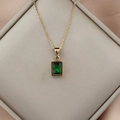 Close-up of 18K gold stainless steel chain with a rectangular green zircon pendant - Dark Green