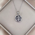 Macro view of Libra zodiac pendant in vintage silver finish with embossed scale design - Libra / Silver-Libra