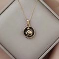 Detail shot of Taurus zodiac necklace with gold-plated pendant in a luxury jewelry box - Gold-Taurus