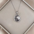 Detail of silver lion zodiac pendant with black enamel inlay in a jewelry box - Silver-Lion