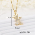 Gold crown letter K necklace pendant with white zircons on a white background - Gold K