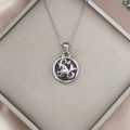 Macro shot of retro zodiac Capricorn pendant necklace in a premium silk gift box - Silver-Capricorn