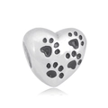 Macro shot of heart-shaped charm with black paw print engravings on polished metal - 3D Heart Paw Print (1)