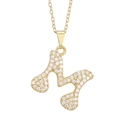 Macro shot of gold-plated heart pendant with letter M and clear cubic zirconia stones - Letter M Pendant Only (Without Chain)