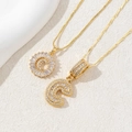 Detail of gold letter C pendants with micro-paved white zircons on fine box chains - Gold - Letter C