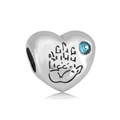 Macro shot of silver heart charm with blue gemstone and paw print engraving detail - Heart With Sky Blue Stone (NO.1)