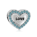 Macro view of a heart-shaped silver bracelet charm with blue crystals and LOVE engraving - Light Blue Heart LOVE Style (NO.1)