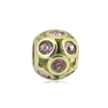 Dettaglio macro di una perla dorata traforata con gemme rosa sfaccettate per gioielli DIY - Decorato con Strass Rosa (NO.8)