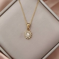 Elegant gold necklace with oval zircon sunflower pendant displayed on grey silk - Ivory