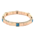 Gold metal elastic bracelet with vertical ribbed texture and rectangular blue crystals - Teal