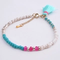 Detail of bohemian beaded bracelet featuring turquoise stones and a light blue tassel - BC170-11 Light Blue Tassel