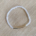 Bracelet en perles de cristal facetté avec tube doré sur tissu beige texturé - Transparent (BC192-21)