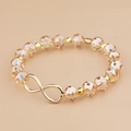 Elegantes champagnerfarbenes Kristallarmband mit goldenem Unendlichkeitssymbol und Perlen - Champagner (BC426-2)