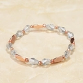 Detail of beaded bracelet with faceted clear crystals and rose gold metal spacers - Transparent Rhombus Style (BC431-9)