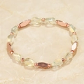 Close-up of yellow beaded bracelet with rose gold metal accents on marble texture - Light Yellow Style (BC431-14)
