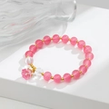 Bracciale di perle di quarzo rosa con ciondolo mughetto e dettagli dorati - Rosa (GBC02-7)