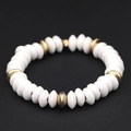 Elastic beaded bracelet with white disc-shaped beads and textured gold accent beads - White (BC404-13)