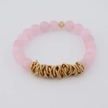 Detail of pink matte beads and golden metal rings on a minimalist beaded bracelet - Pink Frosted (BC468-13)