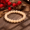 Elegant single-loop cream yellow beaded bracelet on a dark wooden textured background - Milky Yellow Style (GBC025-14)