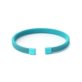 Close-up of turquoise wire mesh texture on a flexible stainless steel open bangle - Teal