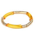 Bracelet extensible avec perles dorées et tubes courbés en acrylique ambre - Jaune d'Or Transparent