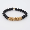 Elastic beaded bracelet with polished black stone beads and central gold interlocking rings - Black (BC468-5)