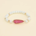Detailed macro shot of a teardrop pink crystal pendant on a white beaded bracelet - Pink (BC510-2)