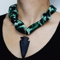 Close-up of leopard print silk scarf necklace with a matte black arrowhead pendant - Green Black Abstract Arrow Pendant Style (NS02-6)