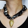 Leopard print silk scarf necklace featuring a textured gold arrow pendant on a model - Gold Arrow Patchwork Fabric Style (NS02-11)