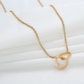 Elegant gold double interlocking heart necklace on white silk fabric background - Double Heart / Rose Gold