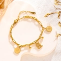 Gold titanium steel bracelet featuring coin charms and a capital letter B pendant - Queen Portrait - Letter B (7831)