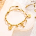 Gold titanium steel bracelet with letter T charm and coin pendant on a white stone - Queen Portrait - Letter T (7829)