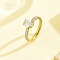 Elegant gold-plated stainless steel ring with oval-cut diamond and pavé side stones - Size 6 / Gold