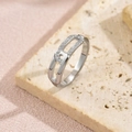 Macro detail of silver geometric link ring with pavé-set zircons on a textured stone - Size 6 / Geometric Link Style (JZ6704) / Steel