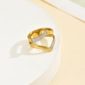 Detail view of double-layered V-shaped gold ring with pave-set zircon stones on white stand - US 6 / Gold