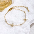 Parure élégante en métal doré avec pierres de zircon blanc et fermoir ajustable - Bracelet Trèfle