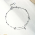 Detail of silver double-layered bead chain with a small black round pendant and lobster clasp - 14k / Silver