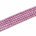 Macro detail of lavender lava stone beads showing natural porous texture and matte finish - 8mm / Pink